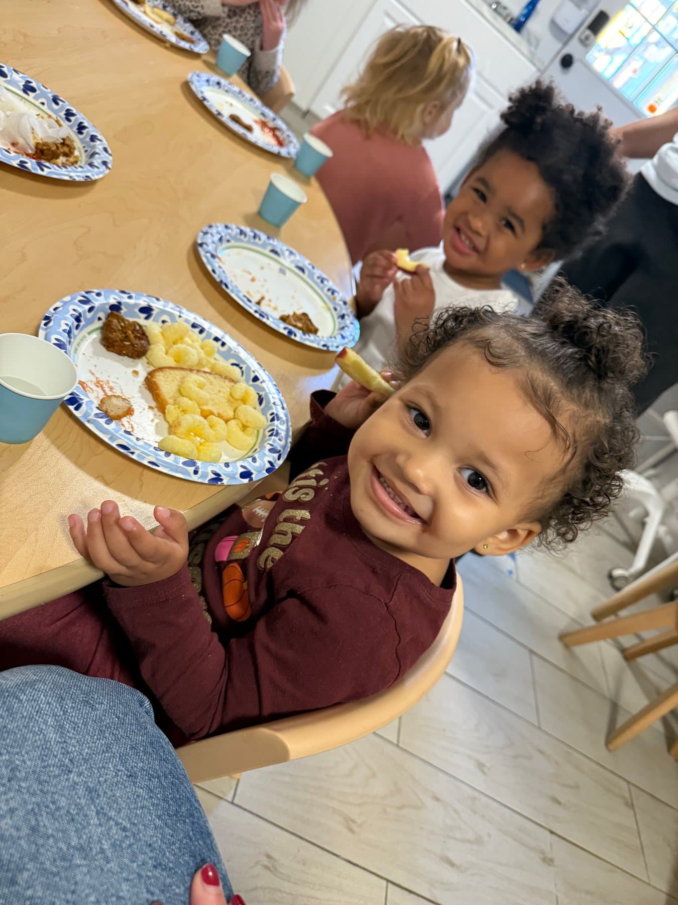 Children sharing a meal together at Rising Scholars