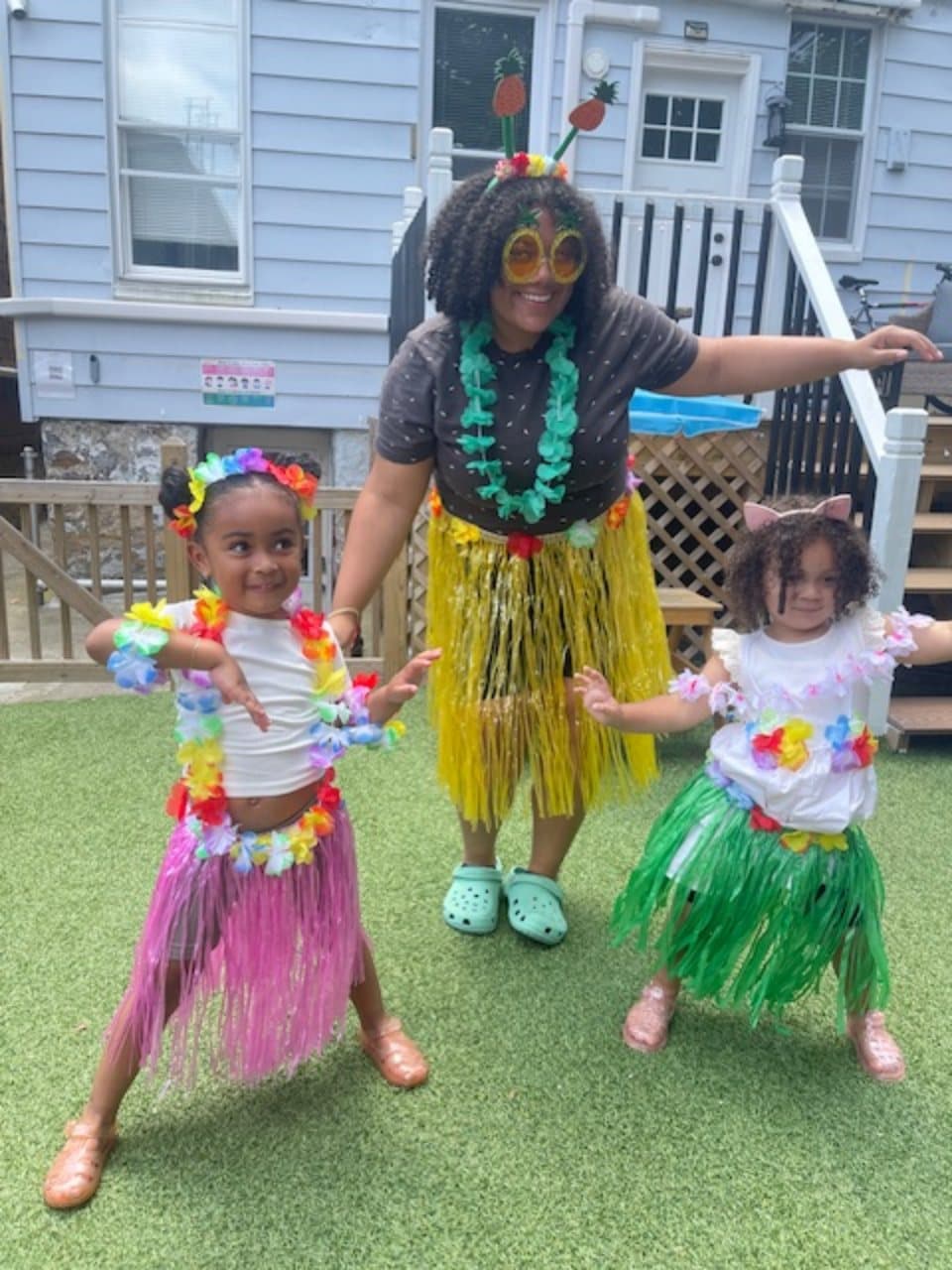 Teacher and children celebrating together during a themed learning day