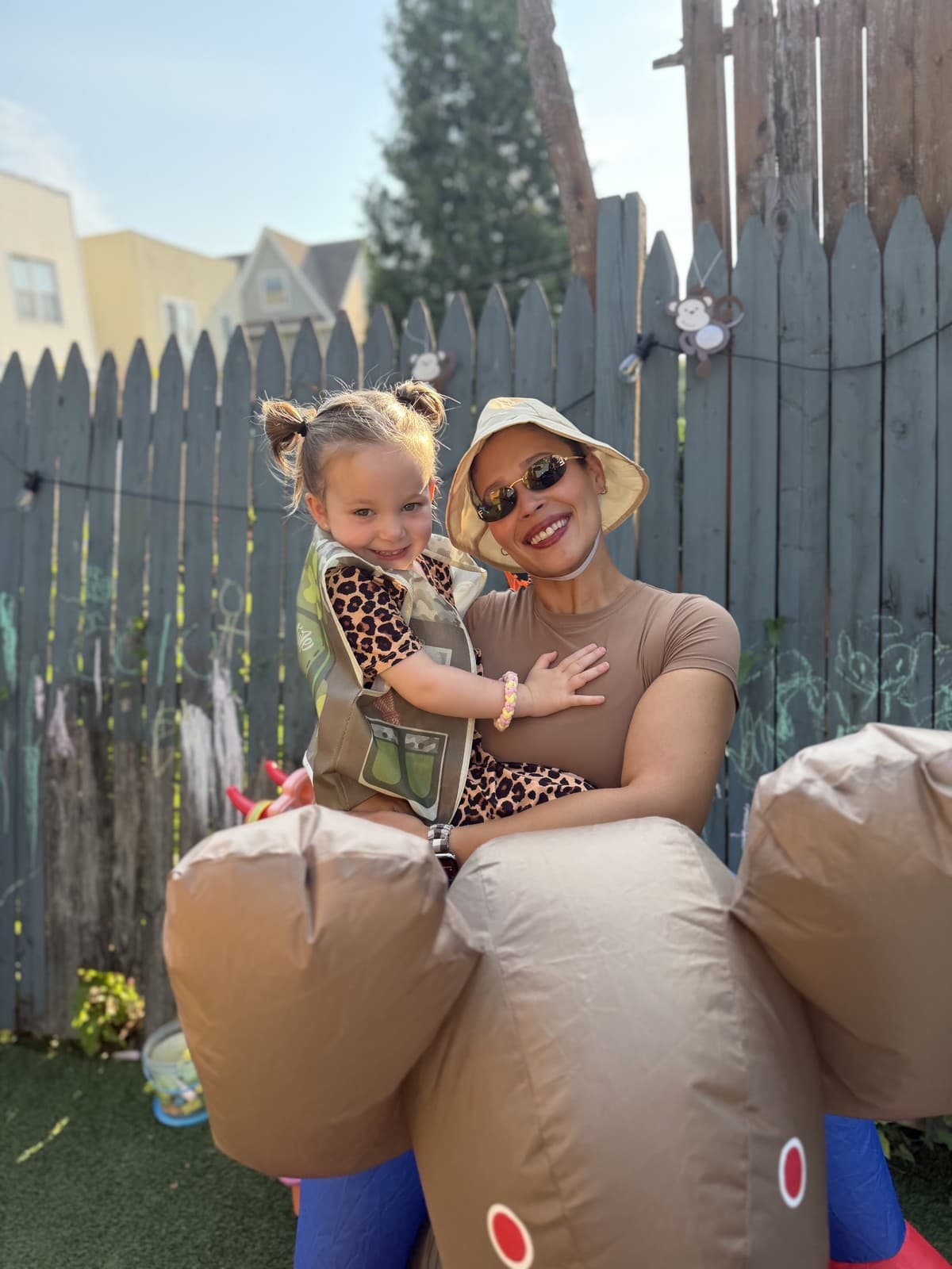 A Rising Scholars teacher and toddler dressed for a safari celebration