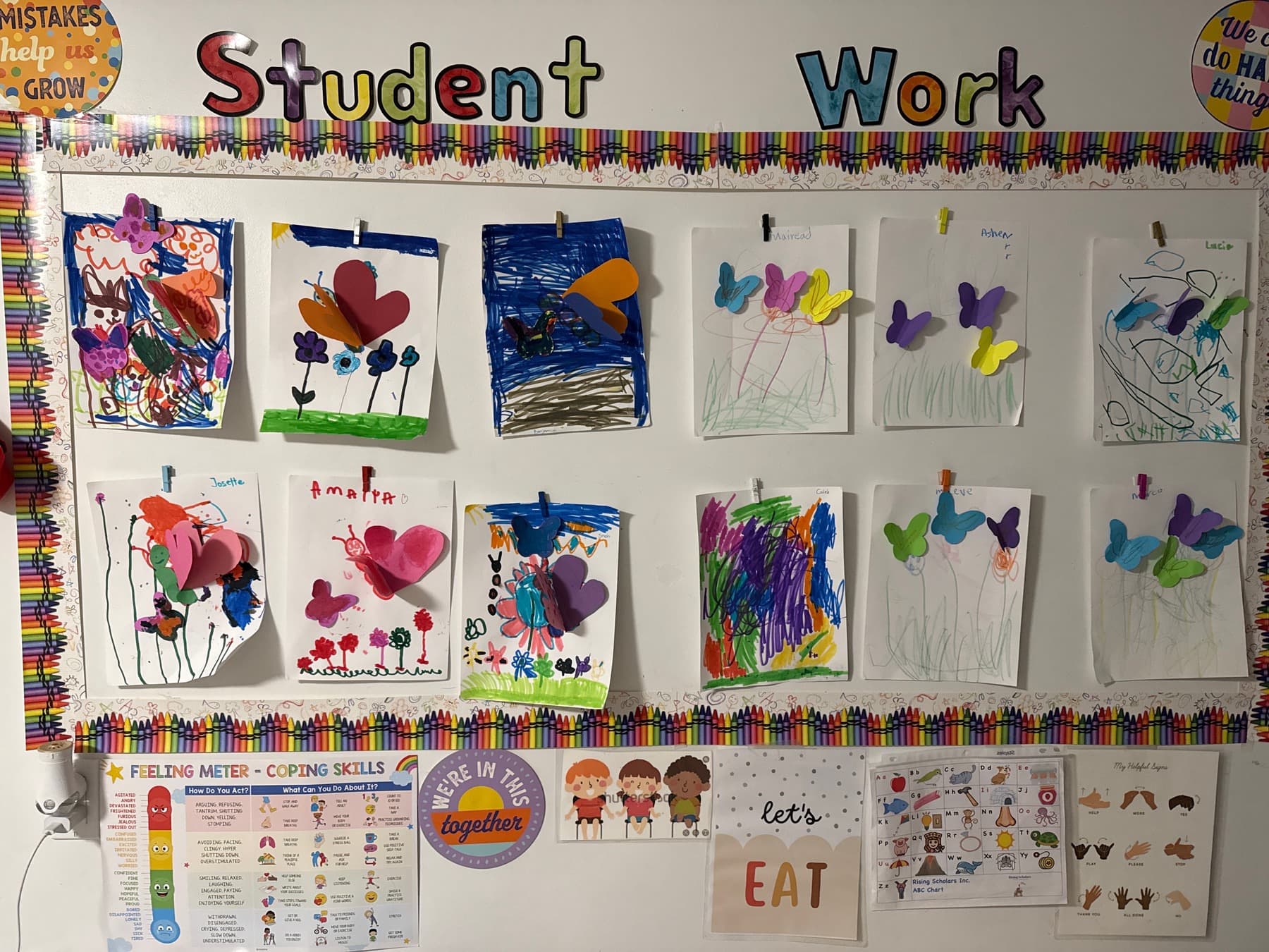 A classroom wall display of children’s creative projects